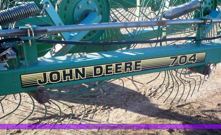 image for item 7002 2006 John Deere 704 wheel rake