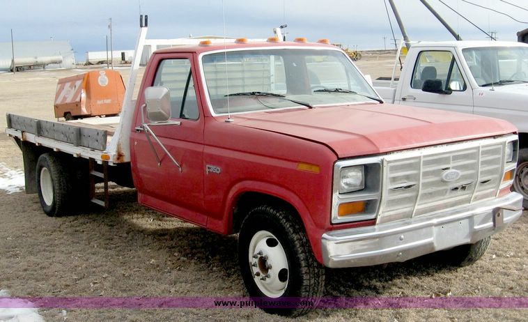 image for item 3758 1984 Ford F-350 pickup with 11' flatbed