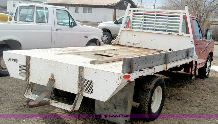 image for item 3758 1984 Ford F-350 pickup with 11' flatbed