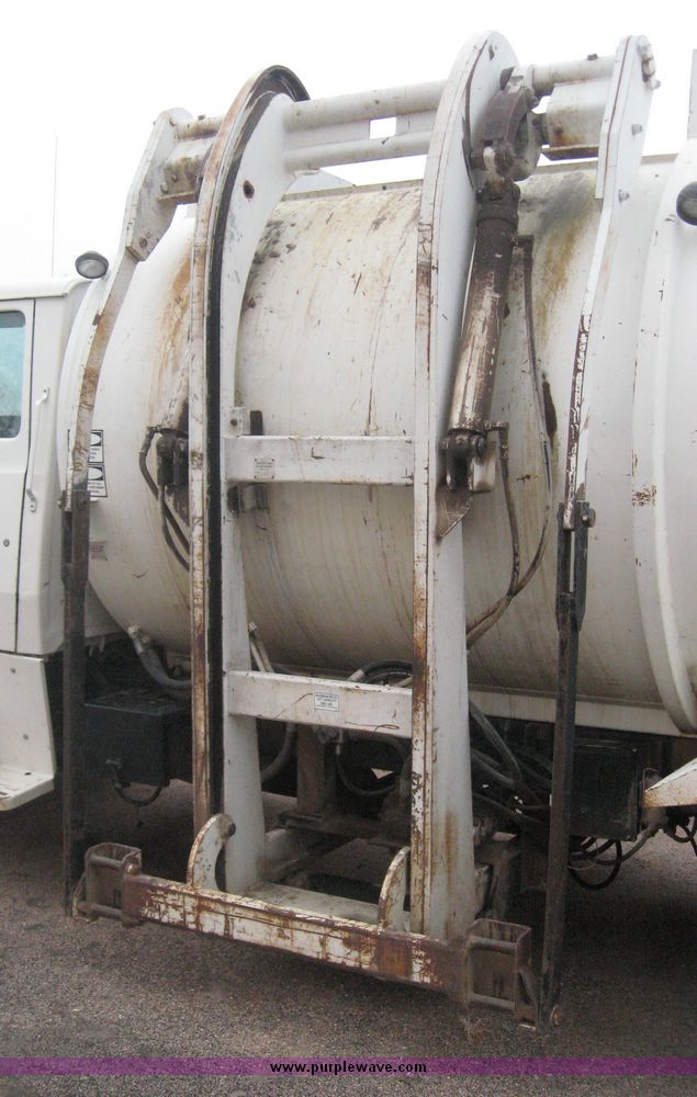 image for item 3805 1994 Ford L8000 tandem axle truck with Impac trash body