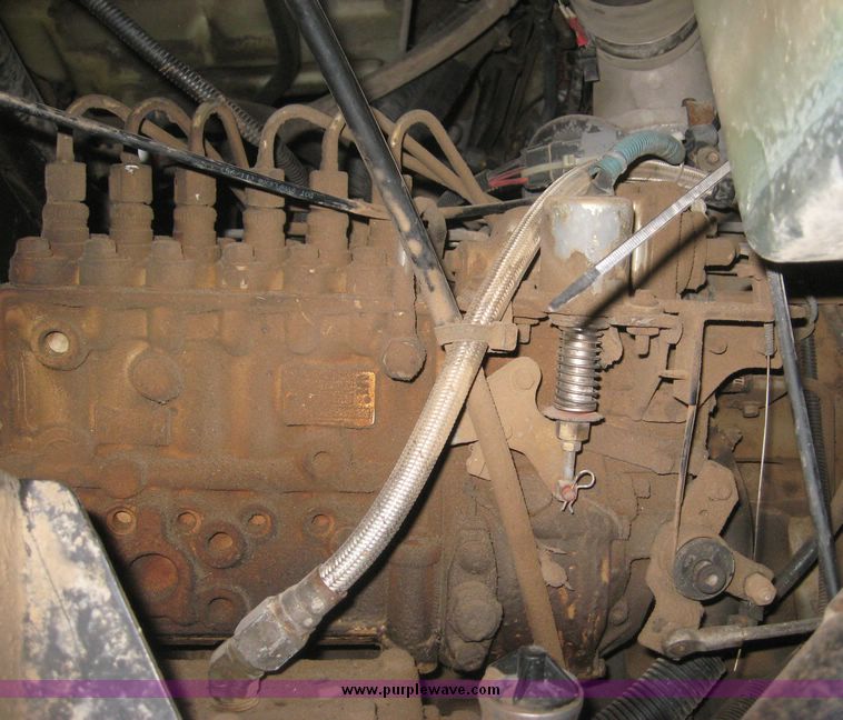 image for item 3805 1994 Ford L8000 tandem axle truck with Impac trash body