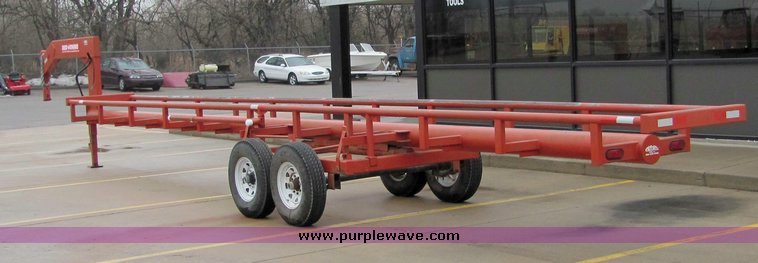 image for item 7035 Red Rhino 36' tandem axle round bale trailer