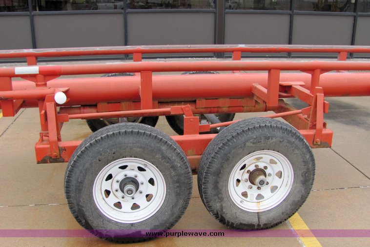 image for item 7035 Red Rhino 36' tandem axle round bale trailer