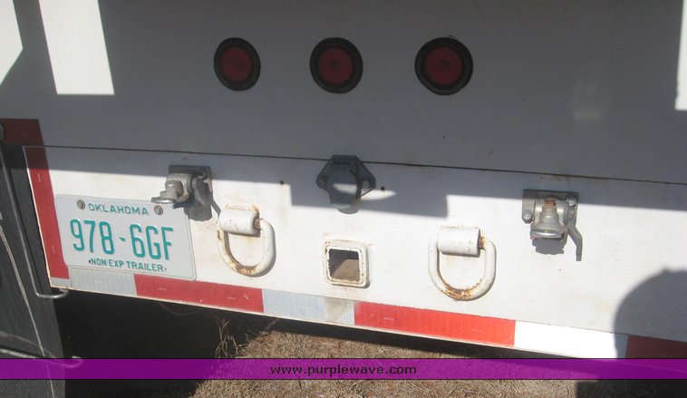 image for item 3813 2004 Shopbuilt grain hopper trailer with header cradle
