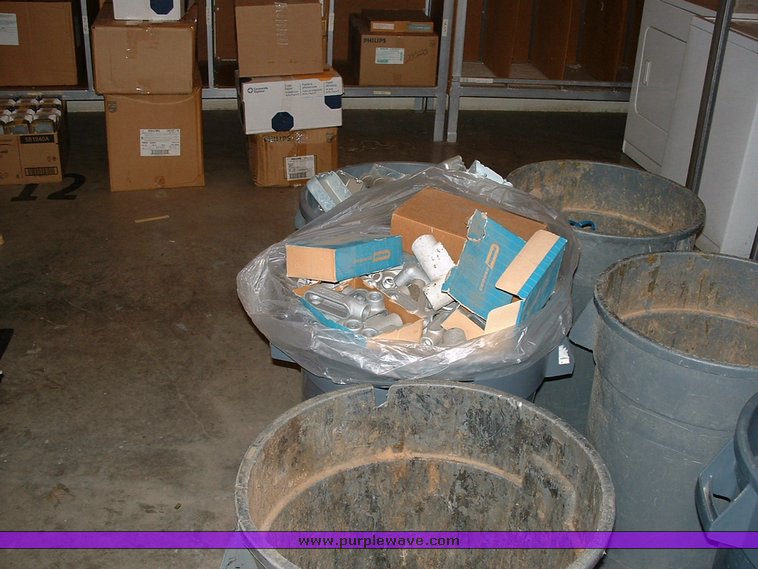 image for item 1005 Assorted ladders, plumbing gate valves and steam radiator valves, electrical boxes, shopping carts, assorted office items, and washer and dryers