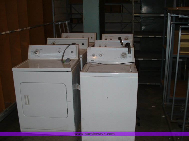 image for item 1005 Assorted ladders, plumbing gate valves and steam radiator valves, electrical boxes, shopping carts, assorted office items, and washer and dryers