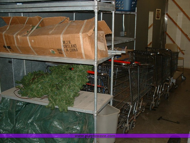 image for item 1005 Assorted ladders, plumbing gate valves and steam radiator valves, electrical boxes, shopping carts, assorted office items, and washer and dryers