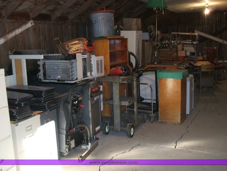 image for item 1005 Assorted ladders, plumbing gate valves and steam radiator valves, electrical boxes, shopping carts, assorted office items, and washer and dryers
