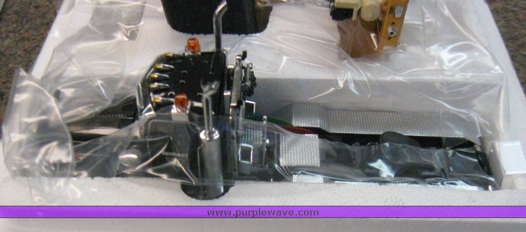 image for item 3032 Scale model of a Vermeer TG7000 tub grinder with loader and Peterbilt 379 four axle day cab semi truck