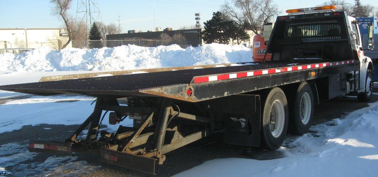 image for item 7693 2006 Freightliner M2 106 roll back truck