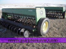 image for item 2300 (2) John Deere 8300 disc drills with two drill hitch