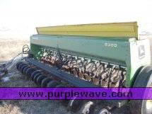 image for item 2300 (2) John Deere 8300 disc drills with two drill hitch