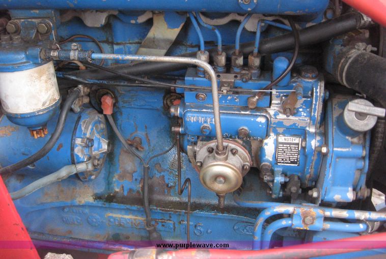 image for item 3876 Ford 7700 tractor with Westenodrf loader