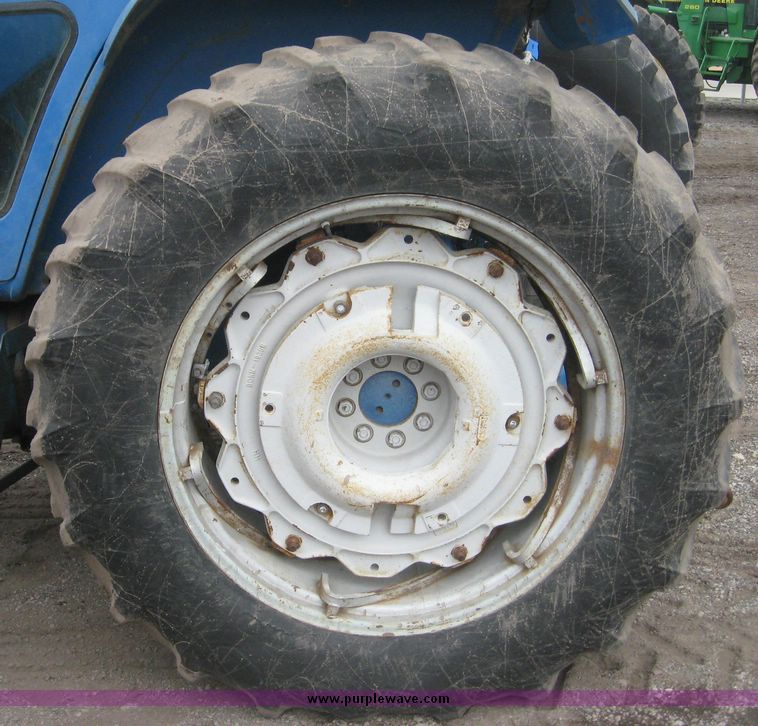 image for item 3876 Ford 7700 tractor with Westenodrf loader