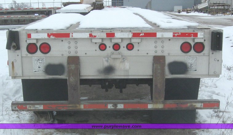 image for item 7810 1997 Wilson CF-900 48' spread axle flat bed trailer