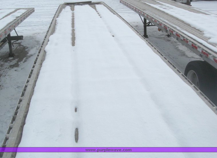 image for item 7818 1997 Wilson 48' spread axle flat bed trailer