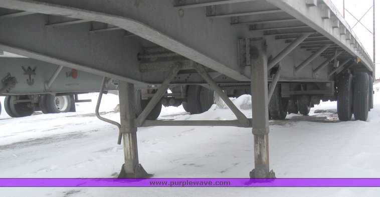 image for item 7818 1997 Wilson 48' spread axle flat bed trailer