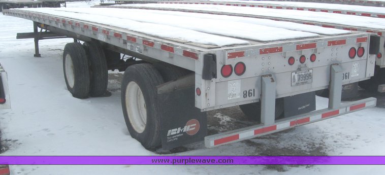 image for item 7819 1997 Wilson 48' spread axle flat bed trailer
