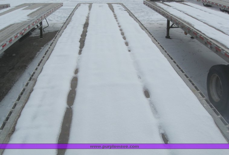 image for item 7819 1997 Wilson 48' spread axle flat bed trailer