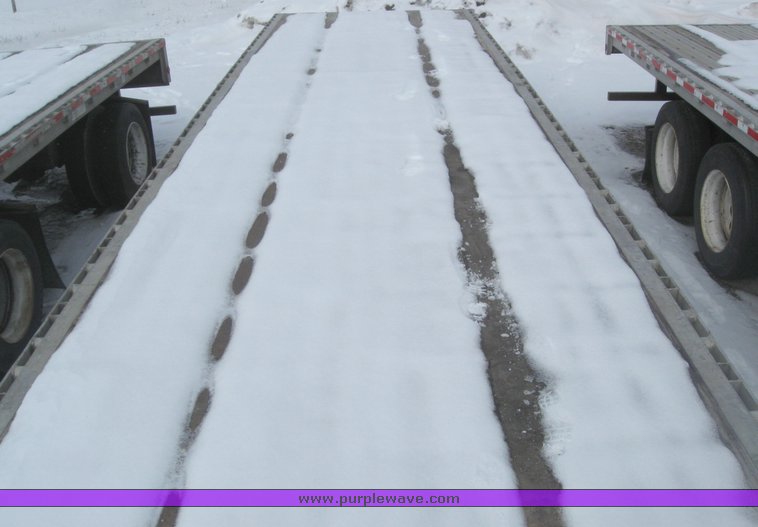 image for item 7819 1997 Wilson 48' spread axle flat bed trailer