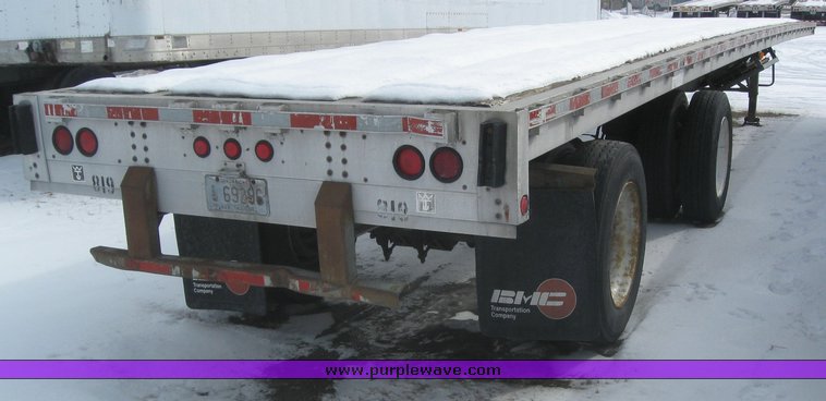 image for item 7820 1995 Wilson 48' spread axle flat bed trailer