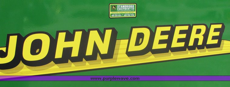 image for item 3048 2001 John Deere 567 round baler