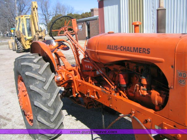 image for item 1100 1955 Allis Chalmers WD45 broom tractor