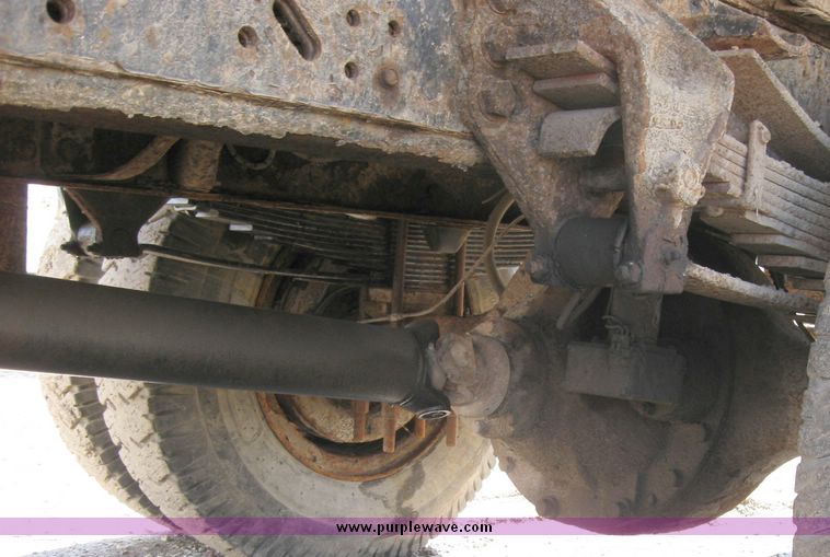 image for item 2075 1990 Ford F-700 dump truck with 8' Flink spreader body