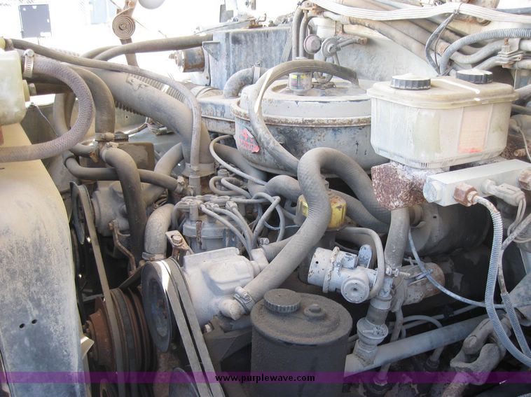 image for item 2075 1990 Ford F-700 dump truck with 8' Flink spreader body