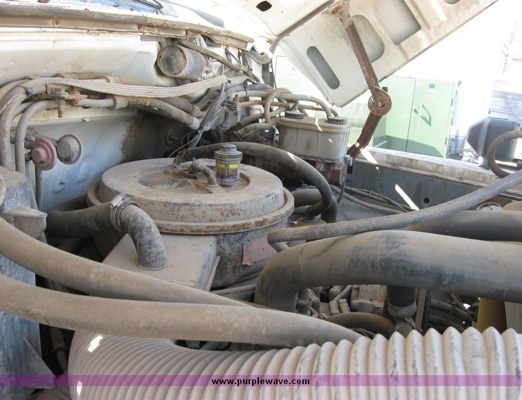 image for item 2075 1990 Ford F-700 dump truck with 8' Flink spreader body