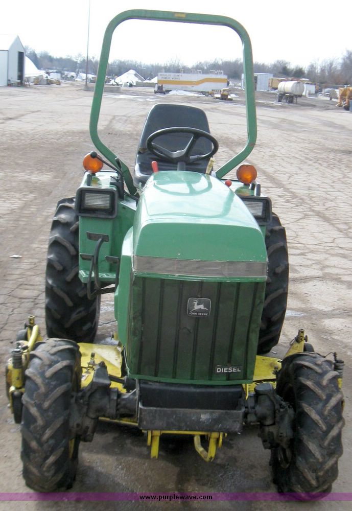 image for item 3355 1994 John Deere 855 MFWD utility tractor with belly mount mower