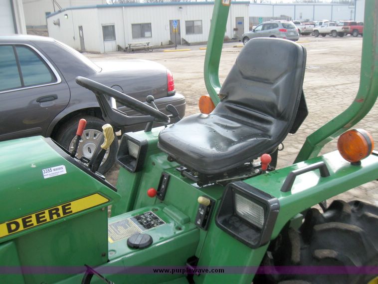 image for item 3355 1994 John Deere 855 MFWD utility tractor with belly mount mower