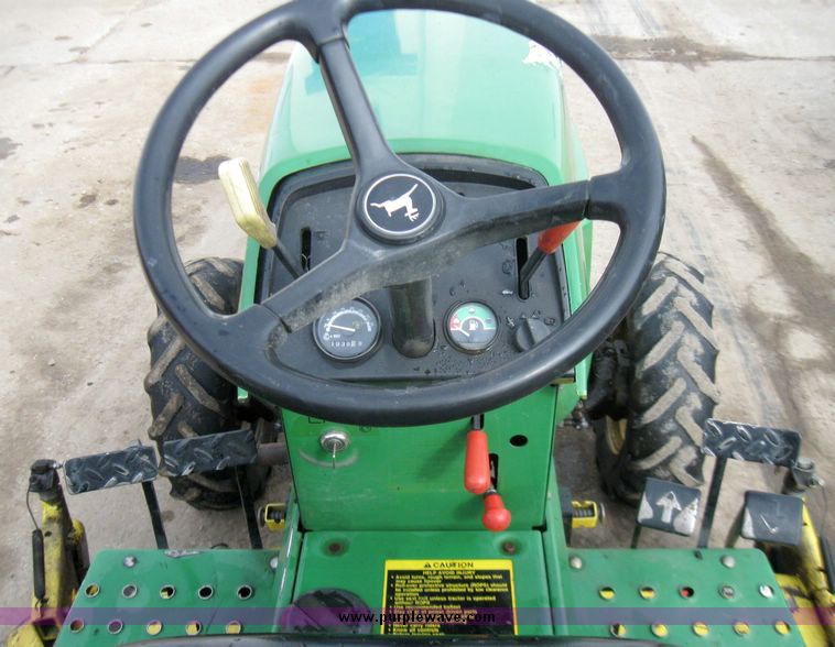 image for item 3355 1994 John Deere 855 MFWD utility tractor with belly mount mower