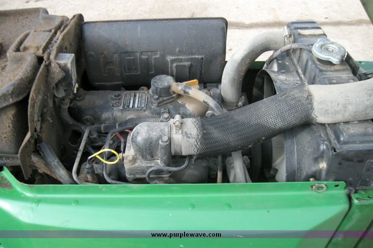 image for item 3355 1994 John Deere 855 MFWD utility tractor with belly mount mower