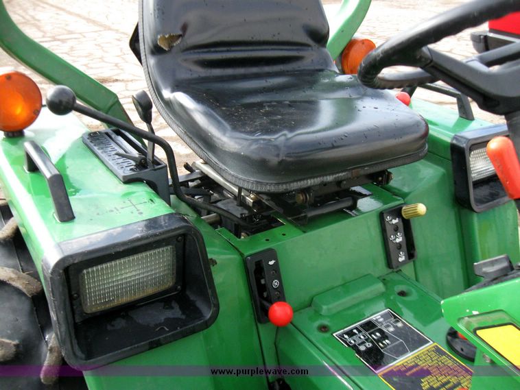 image for item 3355 1994 John Deere 855 MFWD utility tractor with belly mount mower