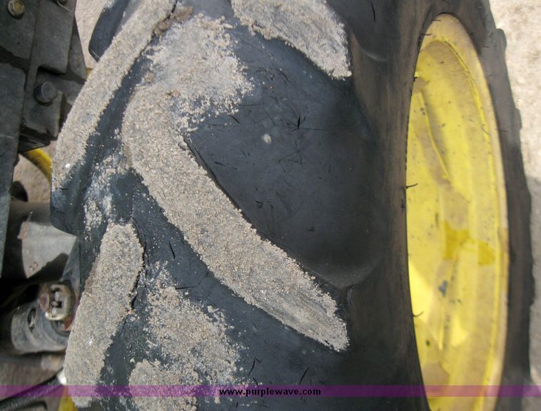 image for item 3355 1994 John Deere 855 MFWD utility tractor with belly mount mower