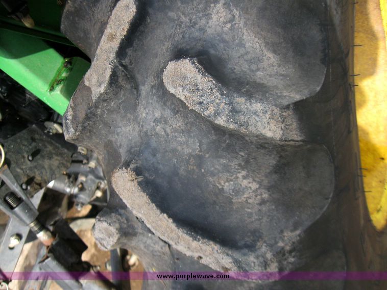 image for item 3355 1994 John Deere 855 MFWD utility tractor with belly mount mower