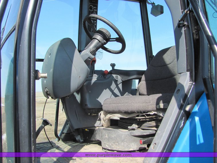 image for item 3034 1999 New Holland TV140 Bidirectional tractor