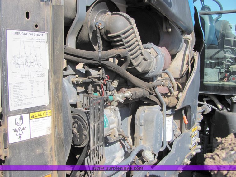 image for item 3034 1999 New Holland TV140 Bidirectional tractor