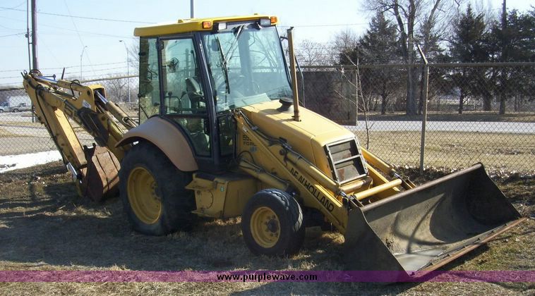 image for item 4608 New Holland 555E backhoe