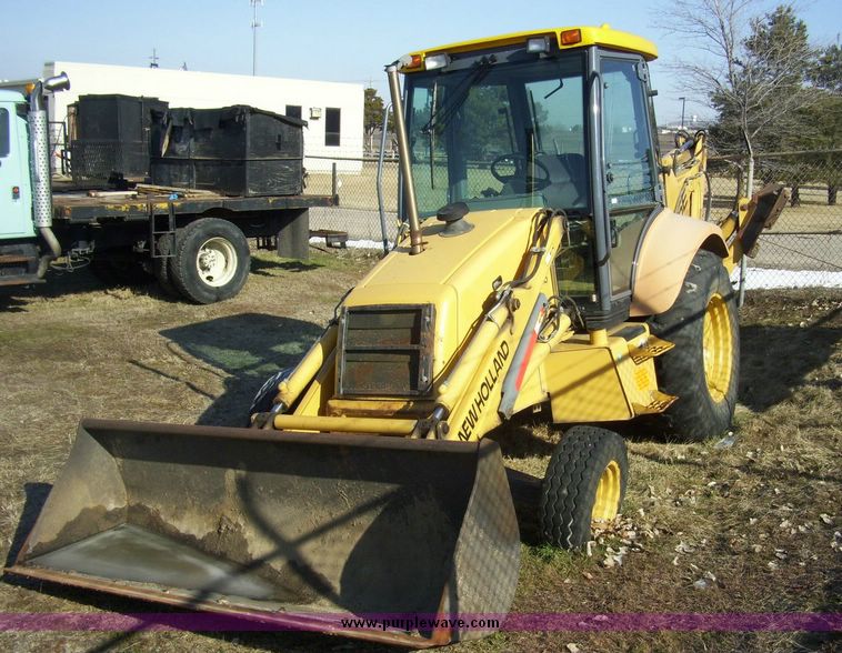 image for item 4608 New Holland 555E backhoe