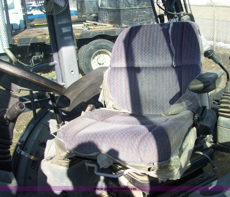 image for item 4608 New Holland 555E backhoe