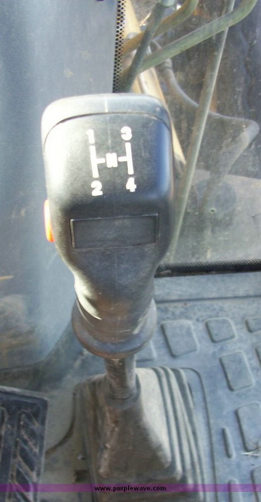 image for item 4608 New Holland 555E backhoe