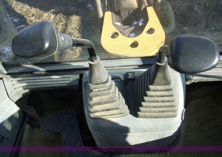 image for item 4608 New Holland 555E backhoe