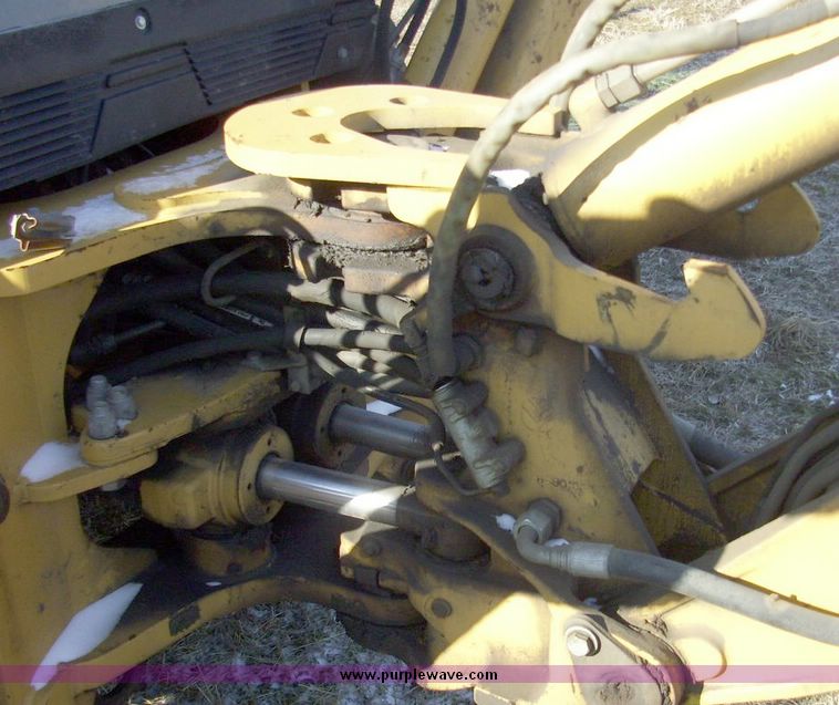image for item 4608 New Holland 555E backhoe
