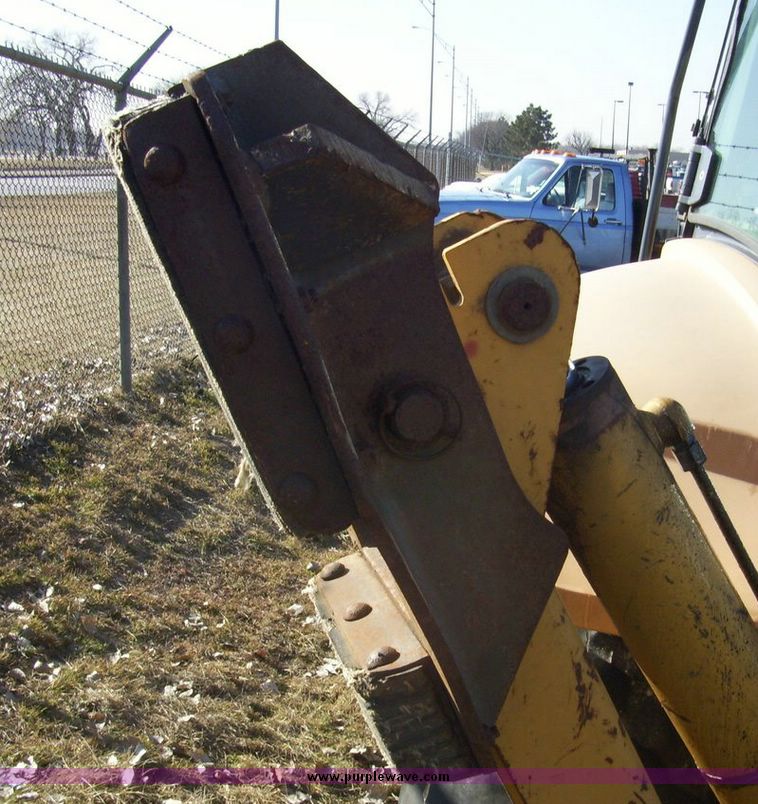 image for item 4608 New Holland 555E backhoe
