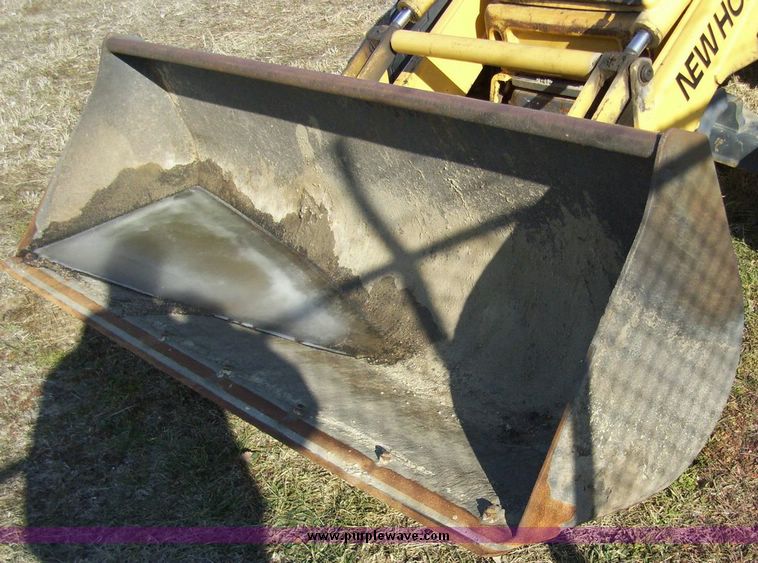 image for item 4608 New Holland 555E backhoe