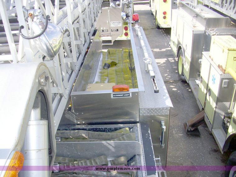 image for item 4651 1993 Sutphen HS2789 75' Quint aerial platform truck