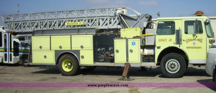 image for item 4652 1987 Sutphen MT1063 75' Quint pumper platform truck