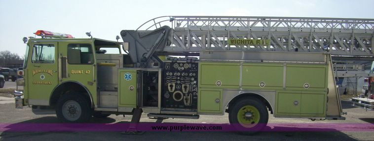 image for item 4652 1987 Sutphen MT1063 75' Quint pumper platform truck